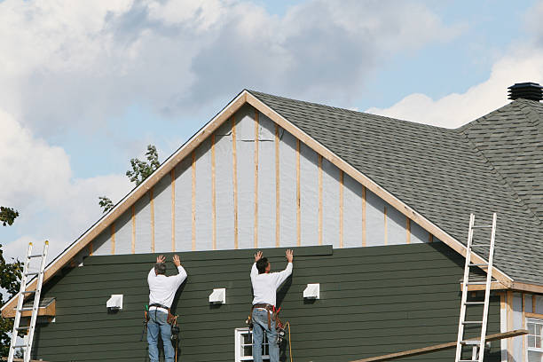 Professional Vinyl Siding technician working in Northport, NY